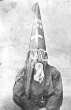 Image of a hooded member of the Ku Klux Clan, c. 1870